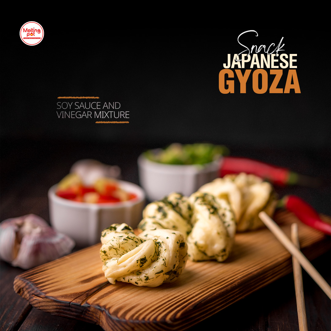 Twisted gyoza dumplings with dipping sauces and side dishes